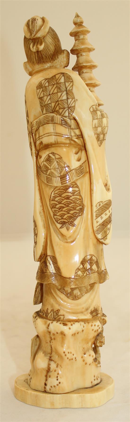 A Japanese walrus ivory figure of an immortal, early 20th century, 23.7cm